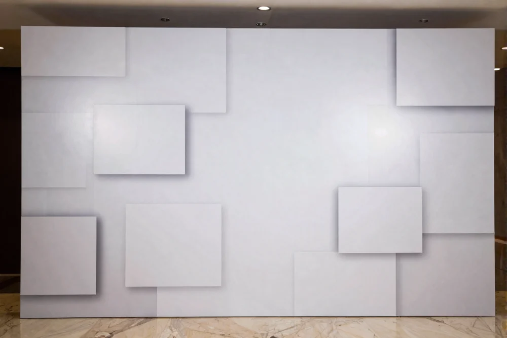 Comprehensive Guide to Event Branding Dubai 1 A sleek step-and-repeat backdrop wall with a matte finish at a corporate event launch.